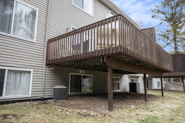 back of house with central AC and a wooden deck