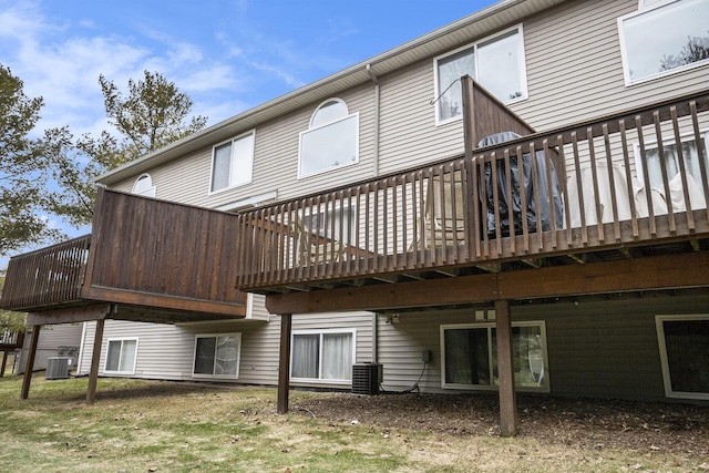 back of house featuring central AC and a wooden deck