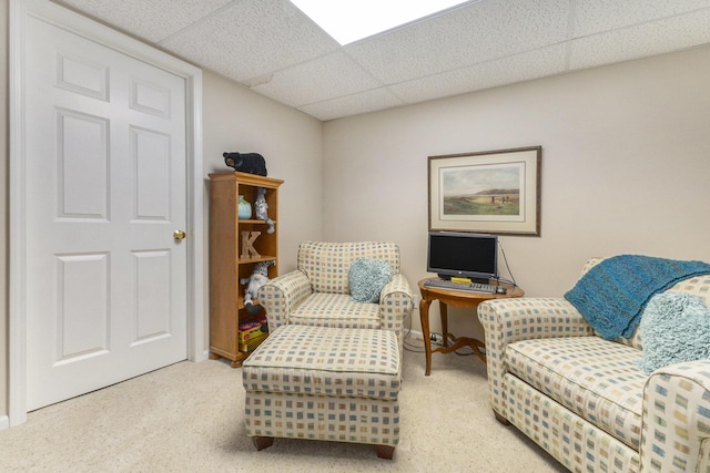 interior space with carpet and a drop ceiling