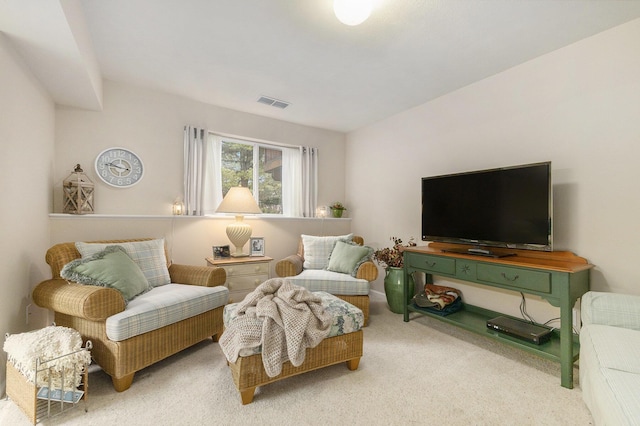 living area with carpet and visible vents