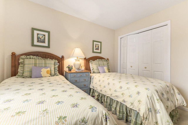 bedroom featuring a closet and carpet flooring