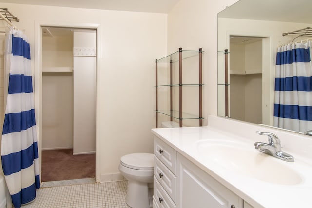 full bathroom with curtained shower, toilet, vanity, baseboards, and tile patterned floors