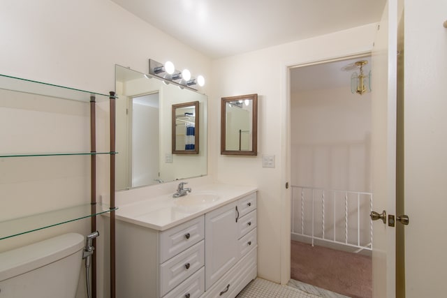 bathroom with toilet and vanity