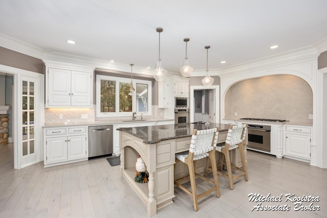 6862 Maplecrest Dr SE, Grand Rapids, MI 49546 - kitchen with arched walkways, a breakfast bar area, a sink, appliances with stainless steel finishes, and open shelves