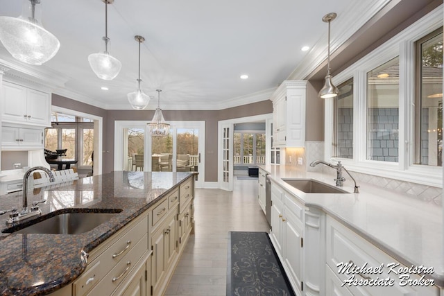 6862 Maplecrest Dr SE, Grand Rapids, MI 49546 - kitchen featuring ornamental molding, light wood-type flooring, french doors, and a sink