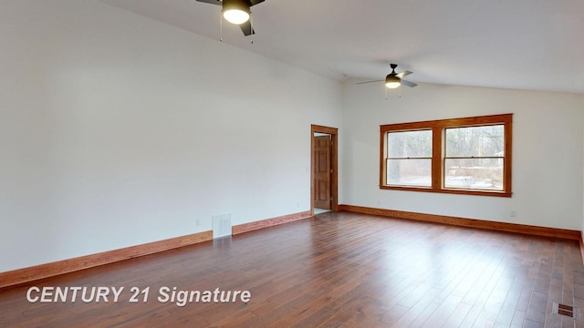 spare room featuring ceiling fan, lofted ceiling, wood finished floors, and baseboards