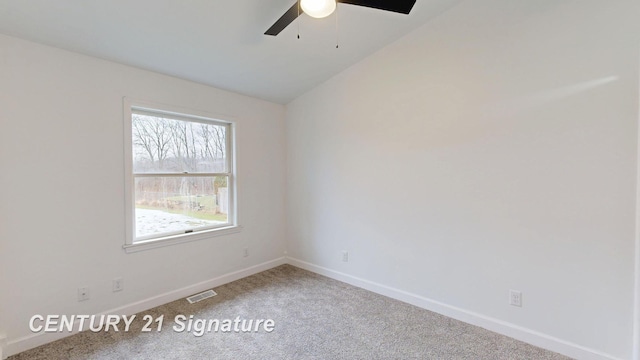 unfurnished room with ceiling fan, light carpet, baseboards, and vaulted ceiling