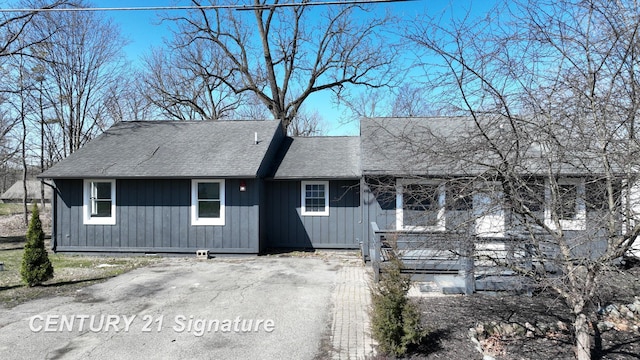 view of front of home featuring roof with shingles