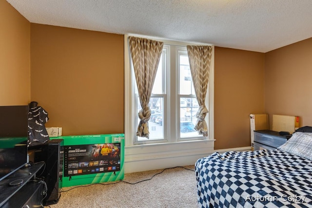 carpeted bedroom with a textured ceiling