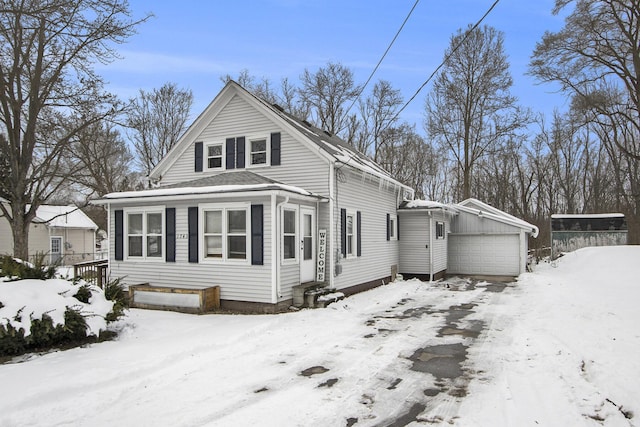 view of snowy exterior featuring a garage