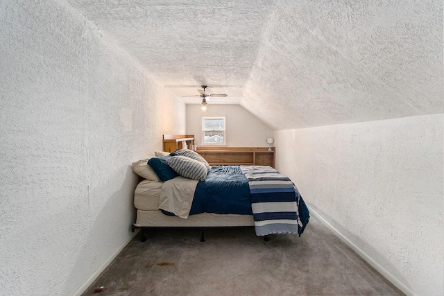 bedroom with baseboards, a textured wall, vaulted ceiling, a textured ceiling, and carpet flooring