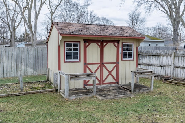 view of shed with a fenced backyard