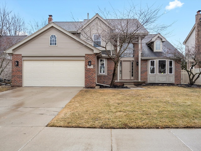 view of front of house with driveway, an attached garage, fence, a front lawn, and brick siding