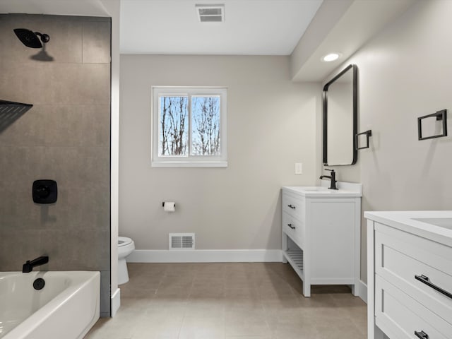 bathroom with vanity, visible vents, and baseboards