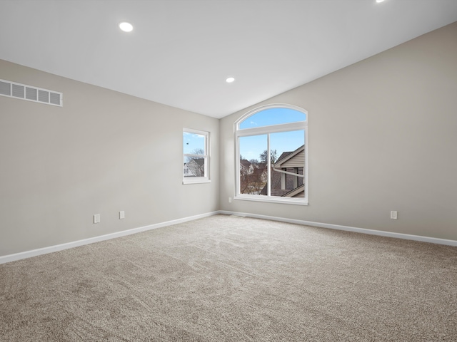 unfurnished room with carpet floors, recessed lighting, visible vents, and baseboards