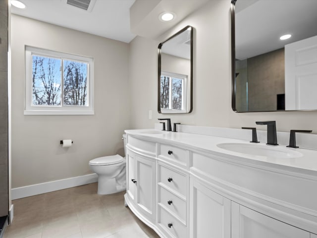 full bath featuring visible vents, plenty of natural light, a sink, and toilet