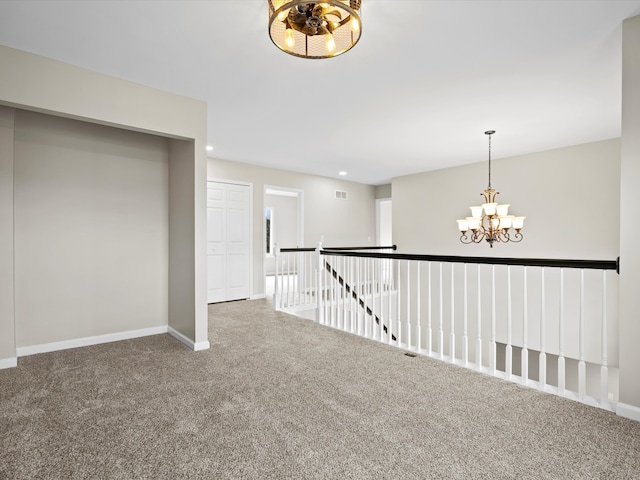 hallway featuring a chandelier, carpet floors, recessed lighting, and baseboards