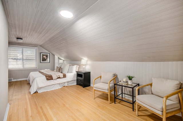 bedroom featuring vaulted ceiling and wood finished floors