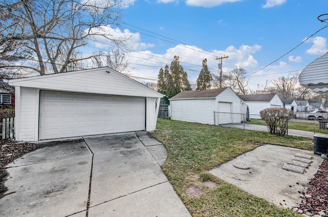 detached garage with central AC unit and fence