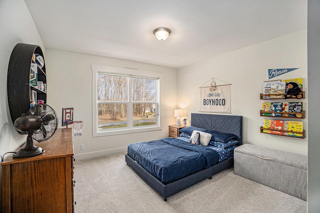 carpeted bedroom with baseboards