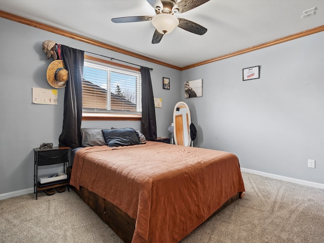 bedroom featuring carpet floors, ornamental molding, a ceiling fan, and baseboards