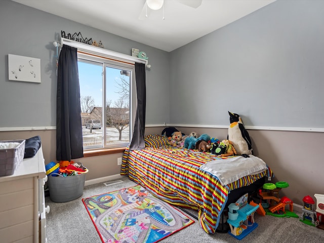 bedroom featuring a ceiling fan, carpet, visible vents, and baseboards