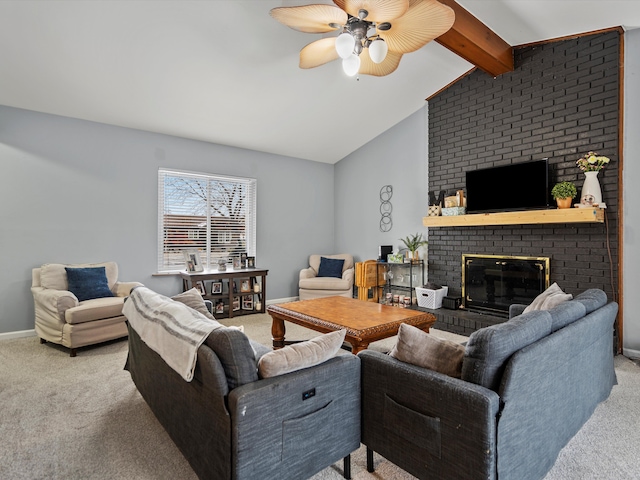 living area with lofted ceiling with beams, ceiling fan, carpet flooring, baseboards, and a brick fireplace