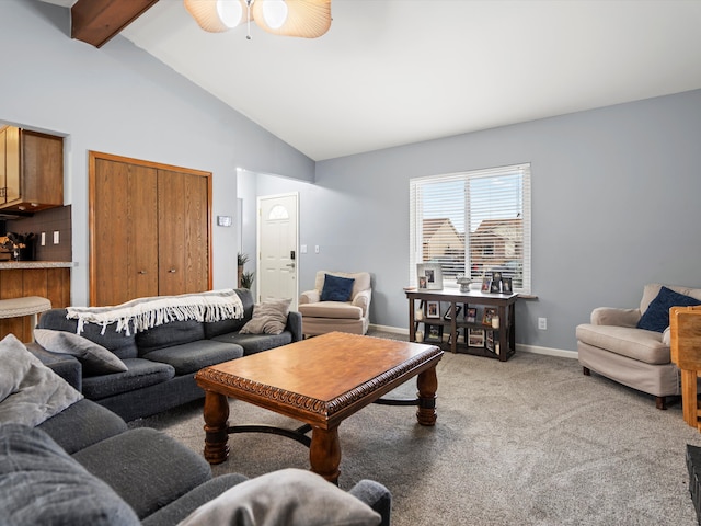 living area with baseboards, a ceiling fan, light colored carpet, high vaulted ceiling, and beam ceiling