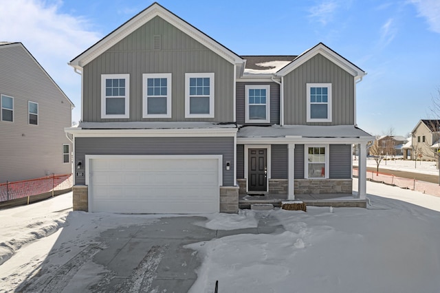 craftsman-style house with a porch, an attached garage, stone siding, driveway, and board and batten siding