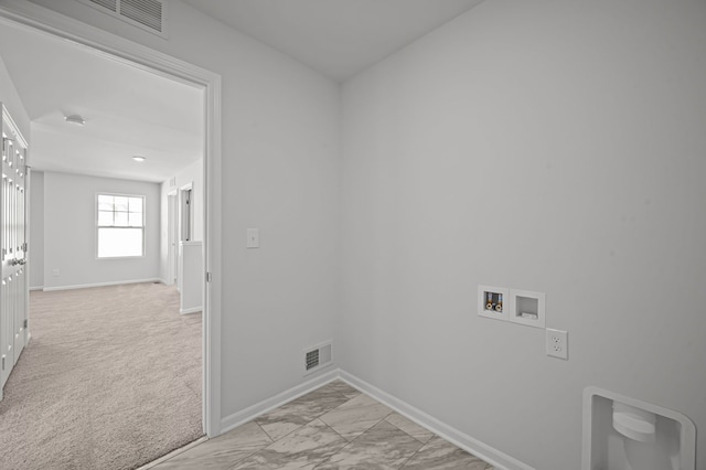 laundry room with hookup for a washing machine, laundry area, visible vents, and baseboards