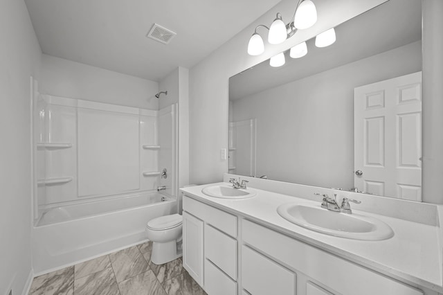 full bathroom featuring toilet, double vanity, a sink, and visible vents