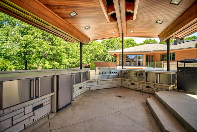 view of patio with grilling area and exterior kitchen