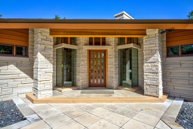 view of exterior entry with stone siding