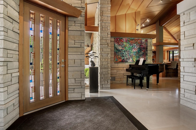 entryway featuring lofted ceiling