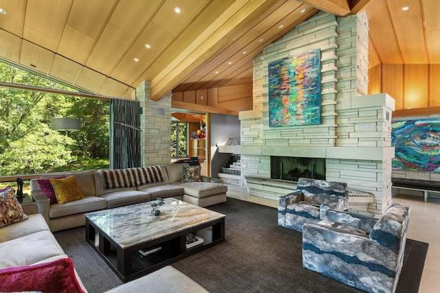 living area featuring high vaulted ceiling, plenty of natural light, a fireplace, and beamed ceiling