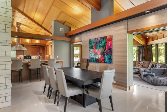 tiled dining area with high vaulted ceiling and wooden ceiling