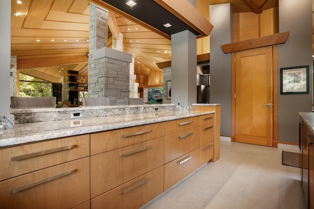 bathroom featuring lofted ceiling, recessed lighting, vanity, and tile patterned floors