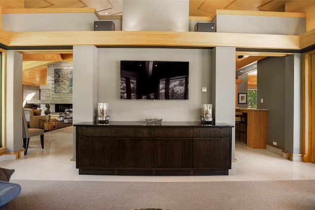 interior space featuring light carpet and a fireplace