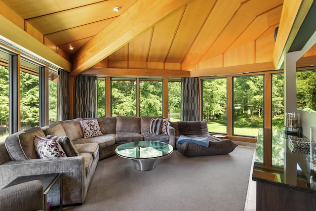 sunroom featuring vaulted ceiling and a wealth of natural light