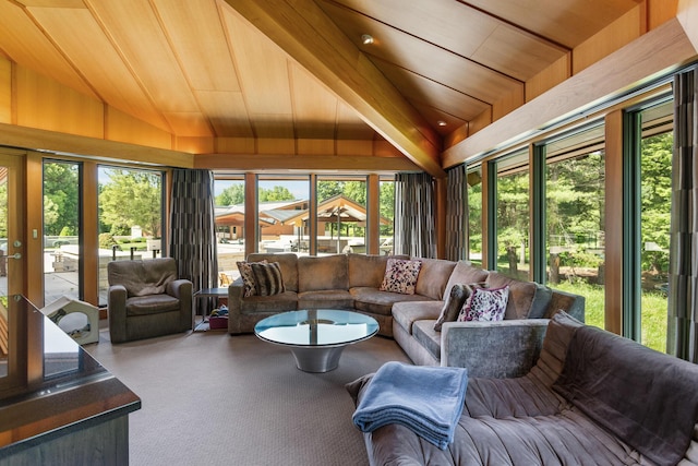 sunroom featuring lofted ceiling and wood ceiling