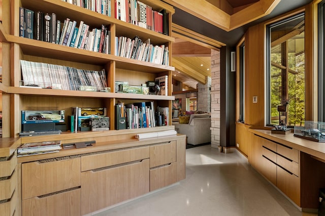 interior space featuring concrete floors and built in study area