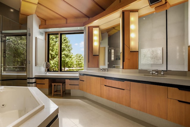 bathroom featuring a stall shower, a sink, a whirlpool tub, and double vanity