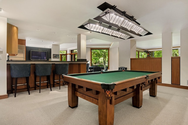 rec room featuring pool table, bar, a wealth of natural light, and light colored carpet