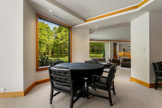 dining area featuring carpet floors, visible vents, and baseboards