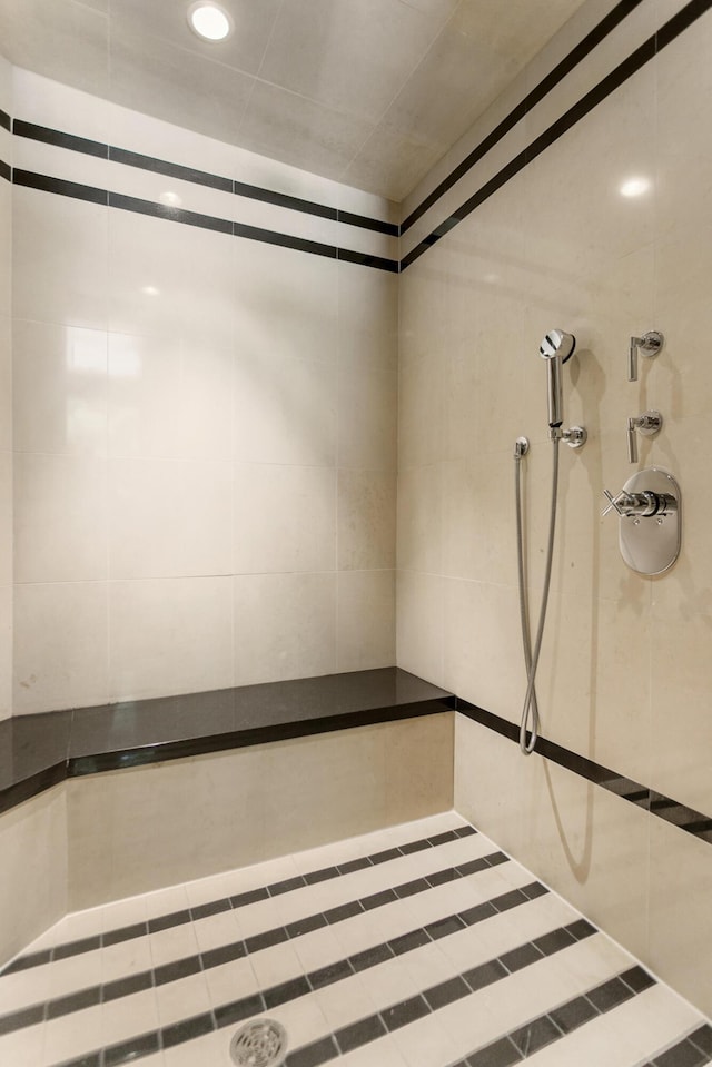 full bathroom with a tile shower