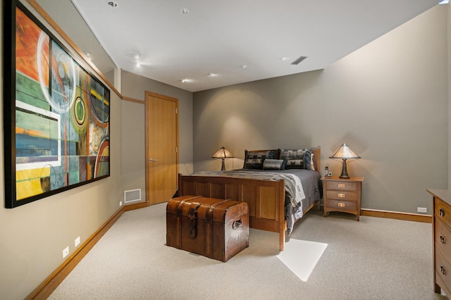 bedroom with baseboards, visible vents, and carpet flooring