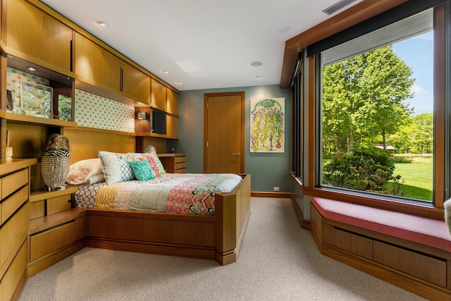 bedroom featuring light colored carpet, multiple windows, baseboards, and recessed lighting