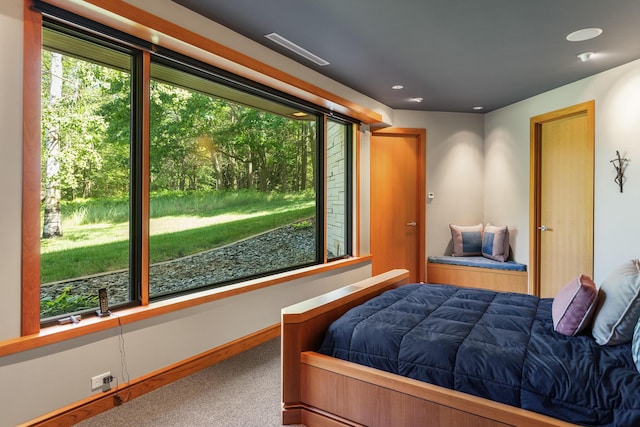 bedroom featuring carpet floors and baseboards