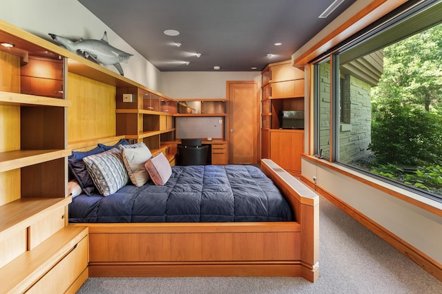 unfurnished bedroom featuring carpet, baseboards, and recessed lighting