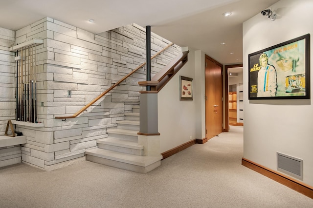 stairs with carpet floors, baseboards, visible vents, and recessed lighting